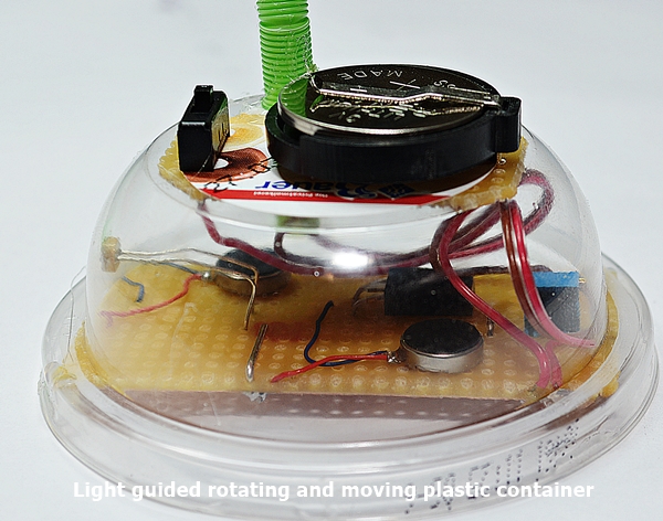 Light guided rotating and moving plastic container